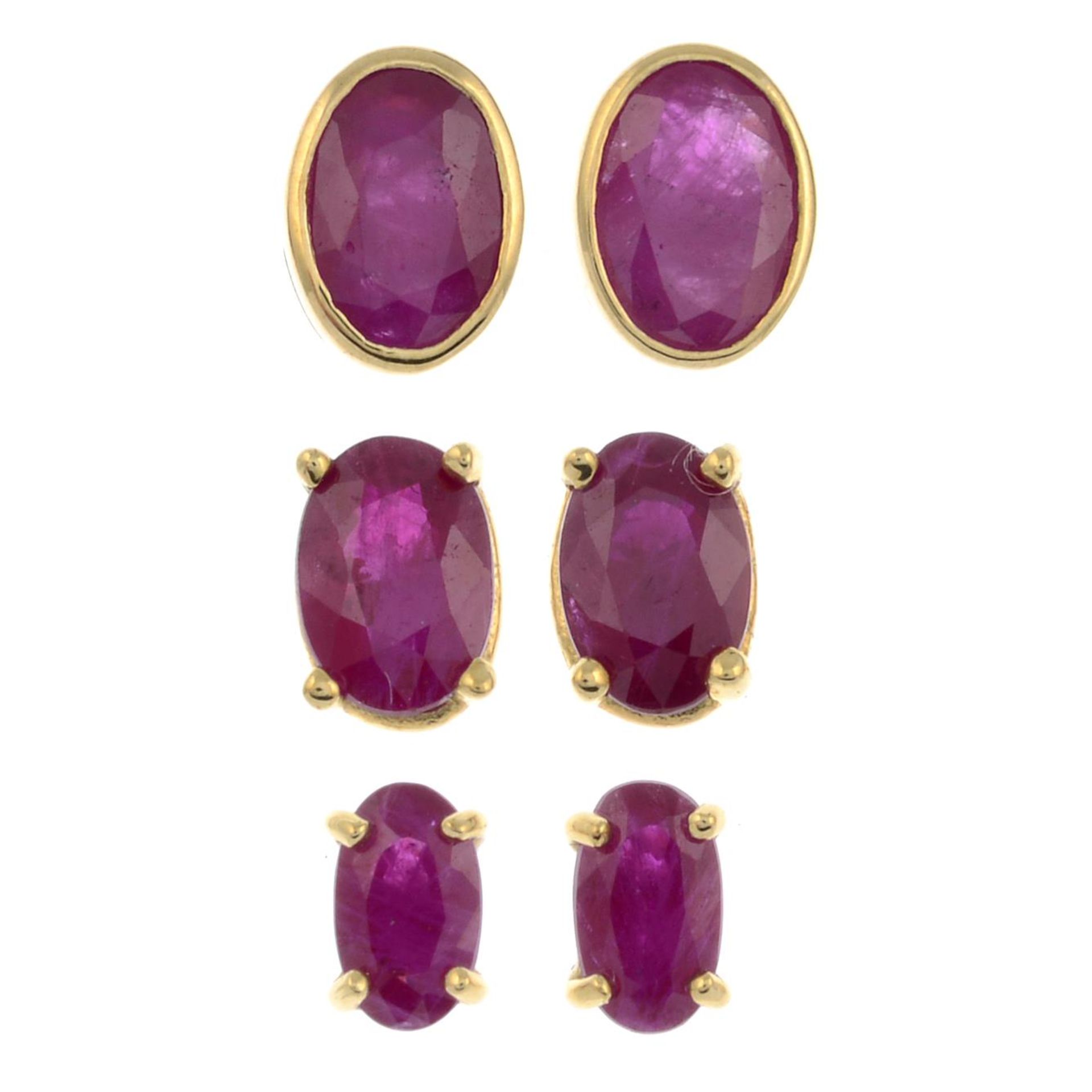 A pair of 9ct gold ruby stud earrings together with two further pairs.One with hallmarks for