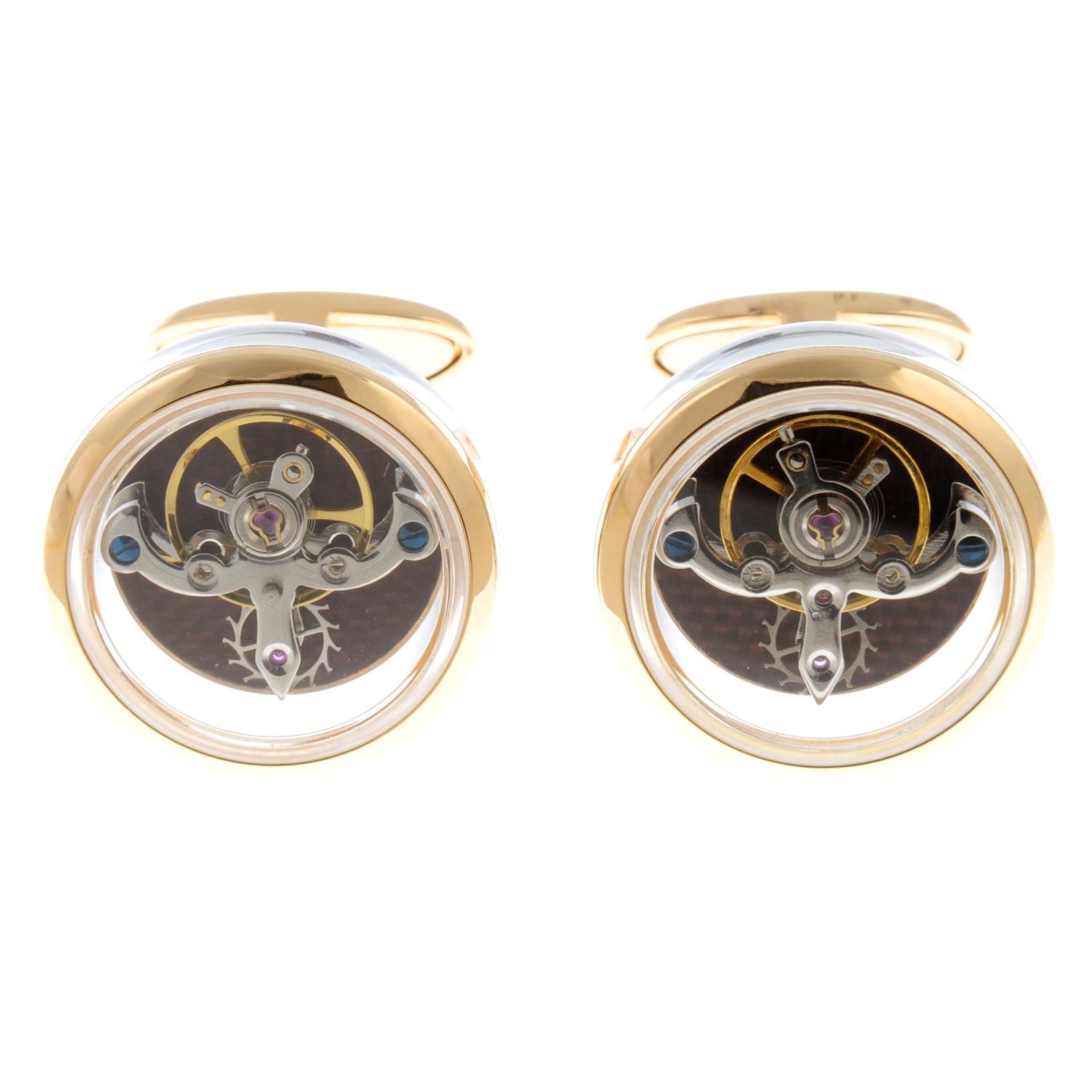 A pair of 18ct yellow gold, sapphire watch movement cufflinks.