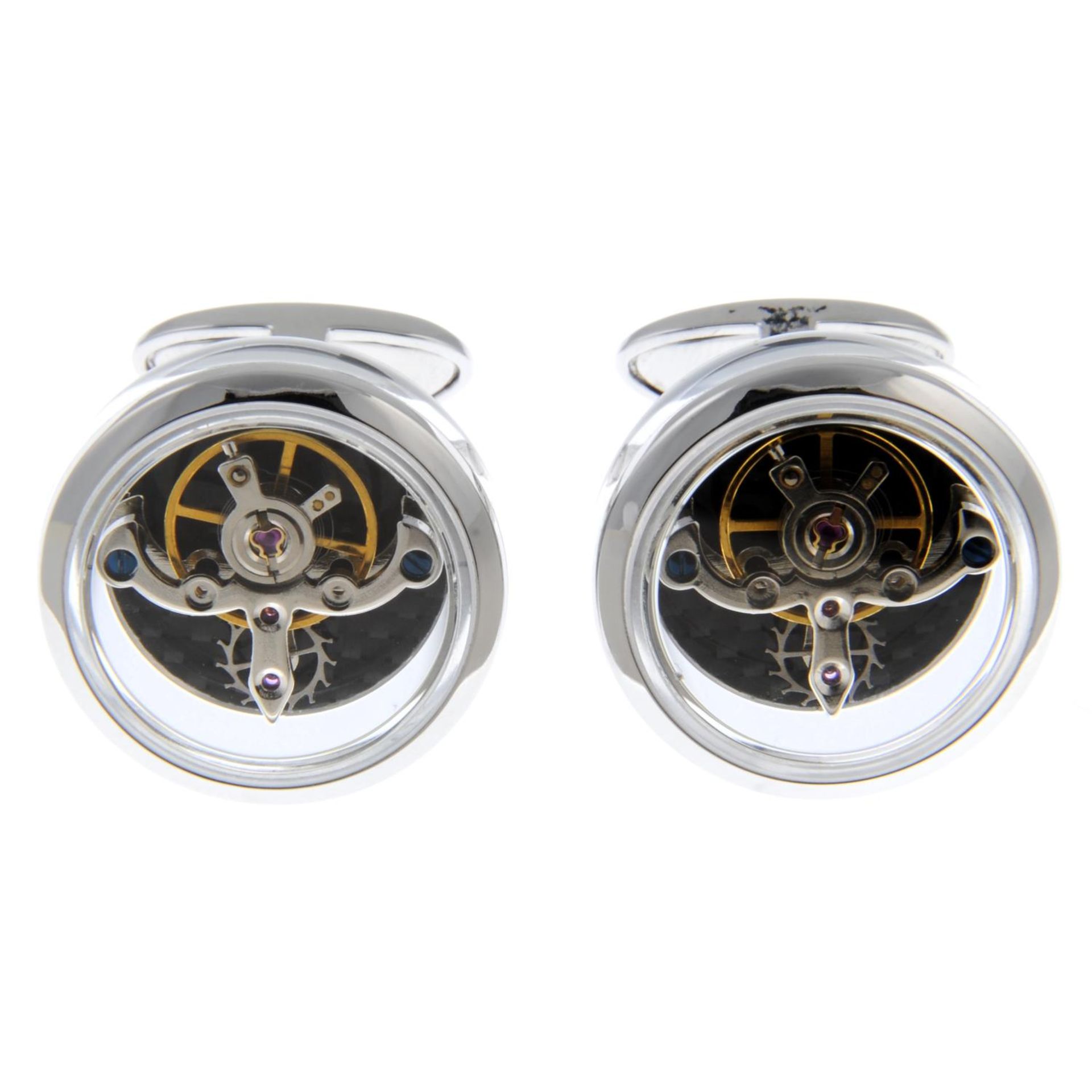 A pair of 18ct white gold, sapphire watch movement cufflinks.