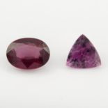 An oval shape garnet with a triangular shape rubellite, weighing 3.52ct and 1.72ct.