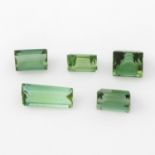 Nine rectangle shape and circular cabochon green and bi-colour tourmalines, weighing 9.51cts.