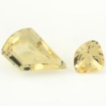 Two fancy shape heliodors, weighing 3.80ct and 14.07ct.