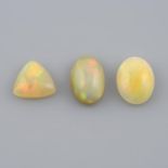 Four vari-shape opal cabochons,