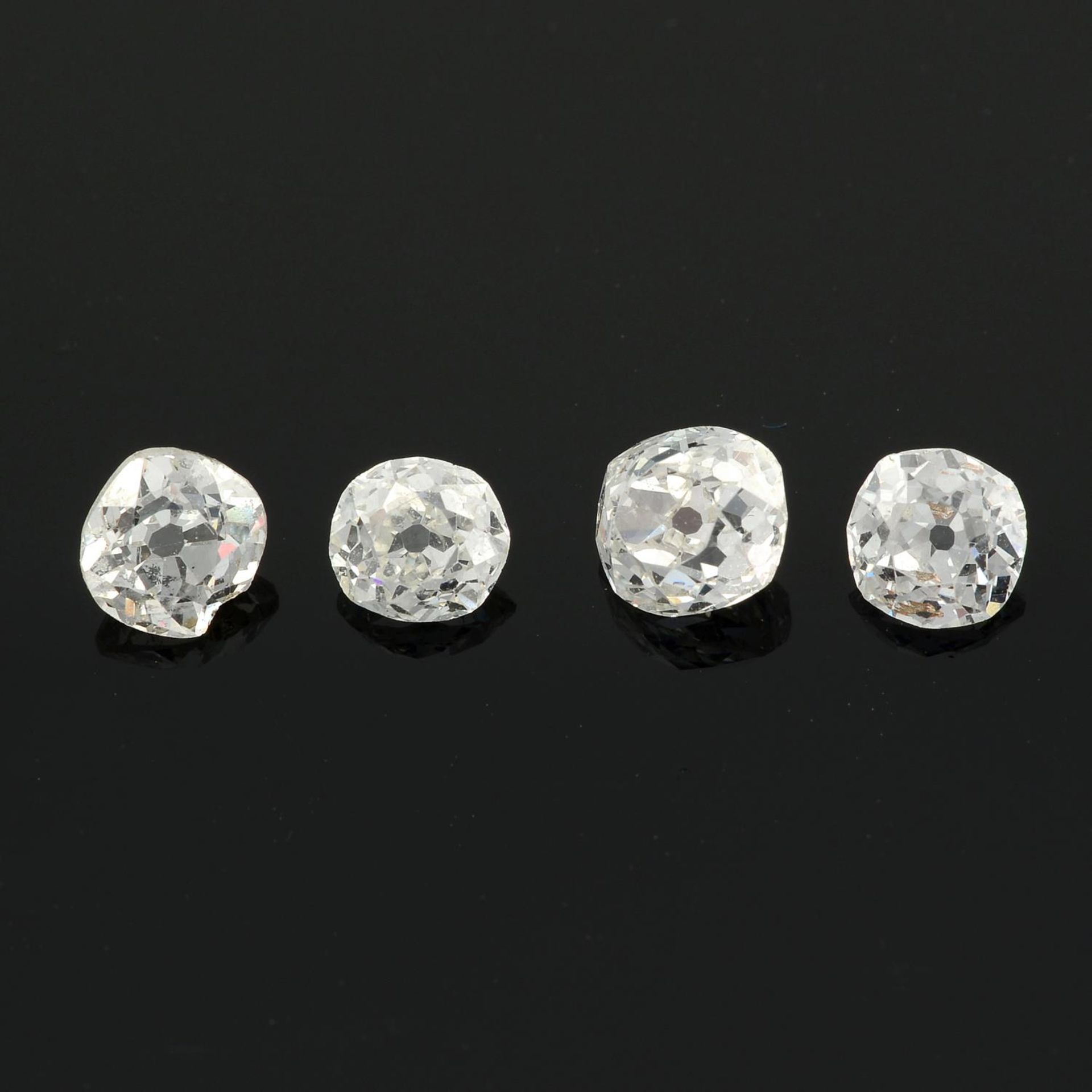 Four old mine cut diamonds.