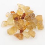 Selection of rough citrine weighing 900grams PLEASE NOTE THIS LOT WILL CARRY VAT AT 20% ON THE