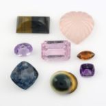 A selection of gemstones, including opals, amethyst, citrine, iolite and moonstone.