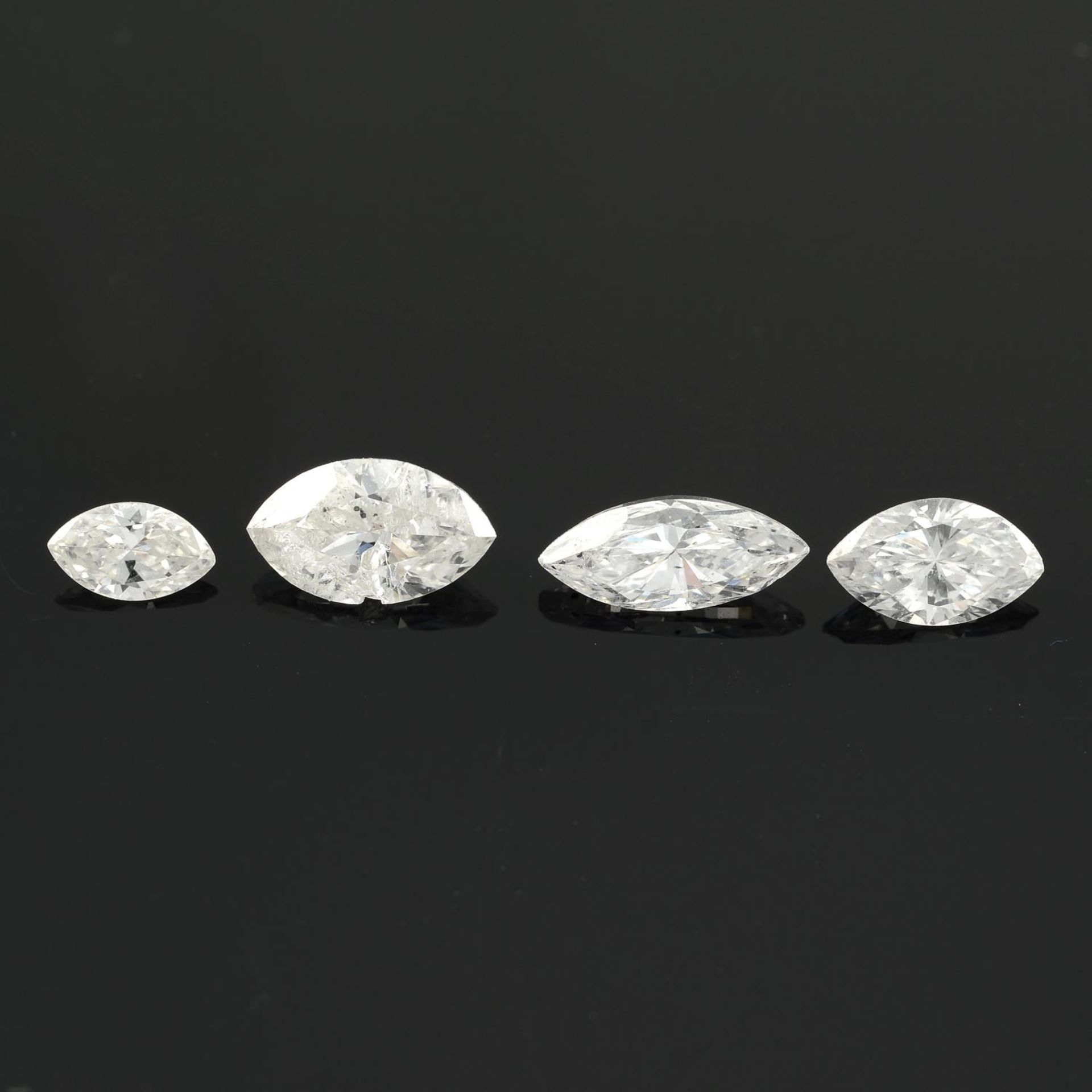 Four marquise shape diamonds.