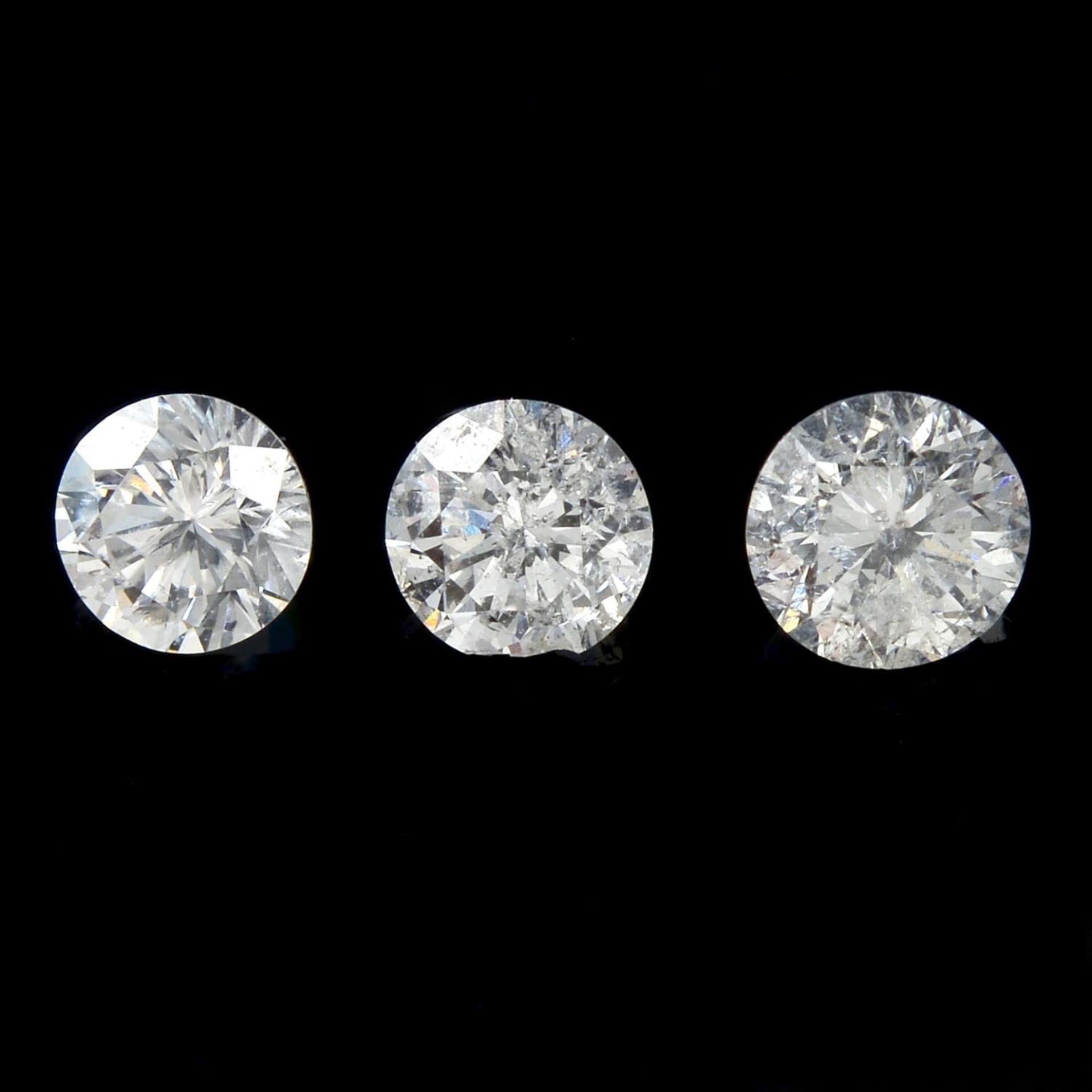 Three brilliant-cut diamonds.