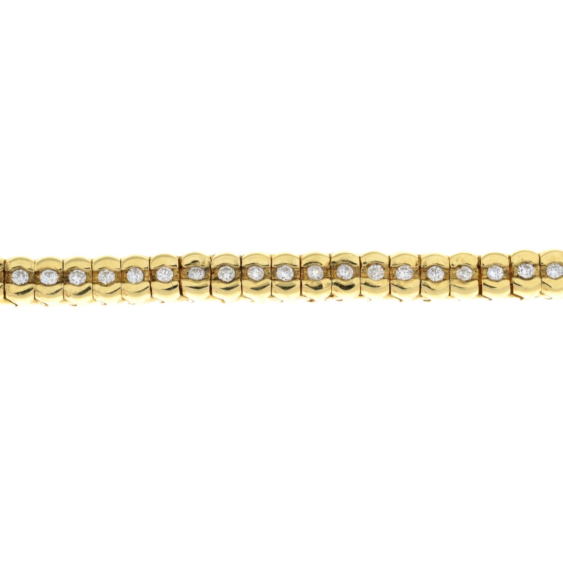 An 18ct gold brilliant-cut diamond bracelet, with push-piece clasp.Total diamond weight 1ct.