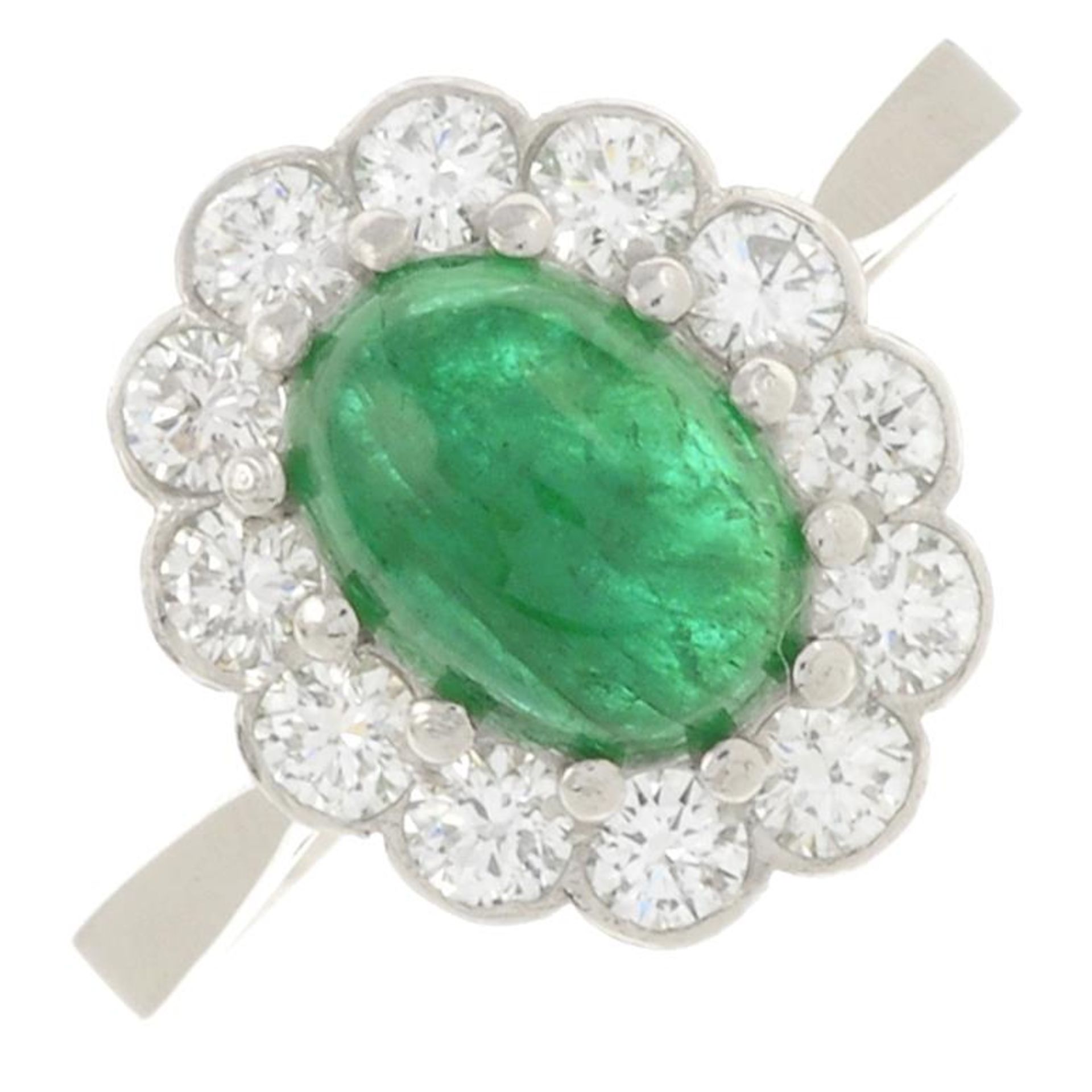 An emerald cabochon and brilliant-cut diamond cluster ring.Emerald calculated weight 1.57ct,