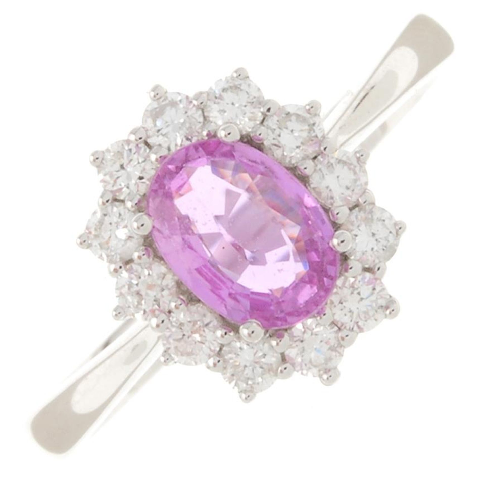 An 18ct gold pink sapphire and brilliant-cut diamond cluster ring.Sapphire weight 0.90ct.Total