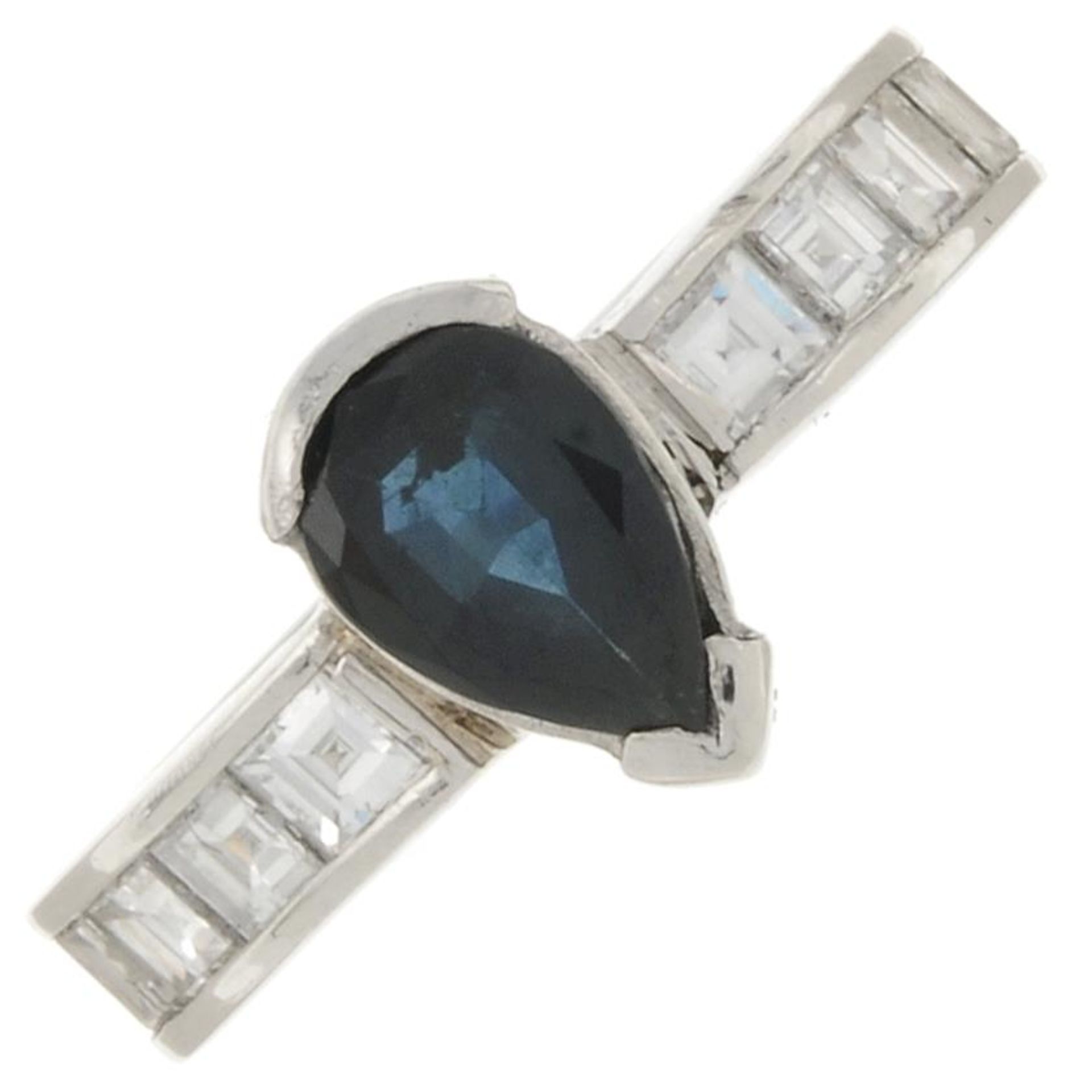 A sapphire and square-shape diamond eternity ring.Sapphire calculated weight 1.14cts,