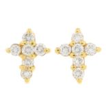 A pair of brilliant-cut diamond cross stud earrings.Total diamond weight 0.23ct.Butterfly backs