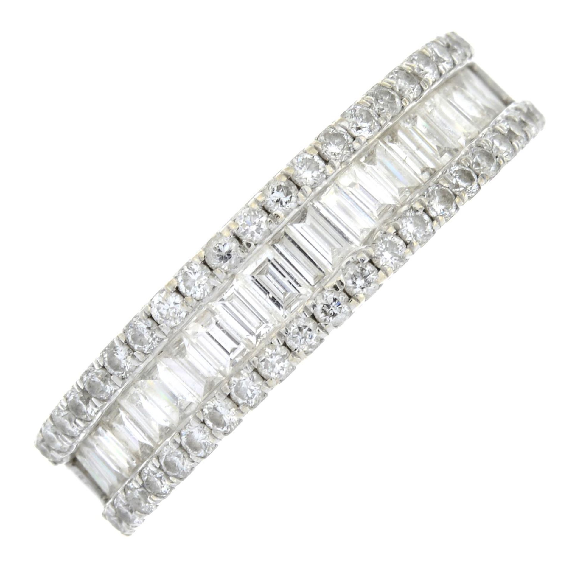 An 18ct gold baguette and brilliant-cut diamond dress ring.Total diamond weight 0.40ct,