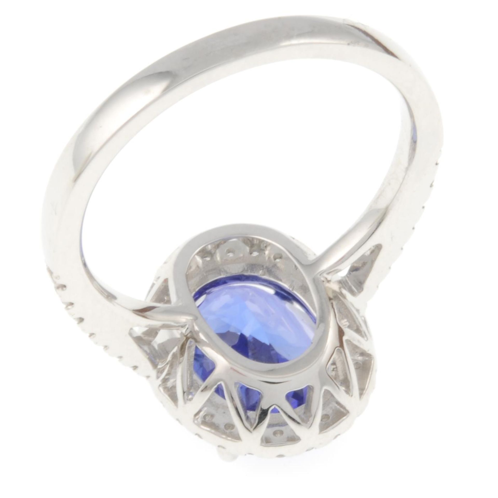 An 18ct gold tanzanite ring, with brilliant-cut diamond surround and sides. - Image 4 of 4