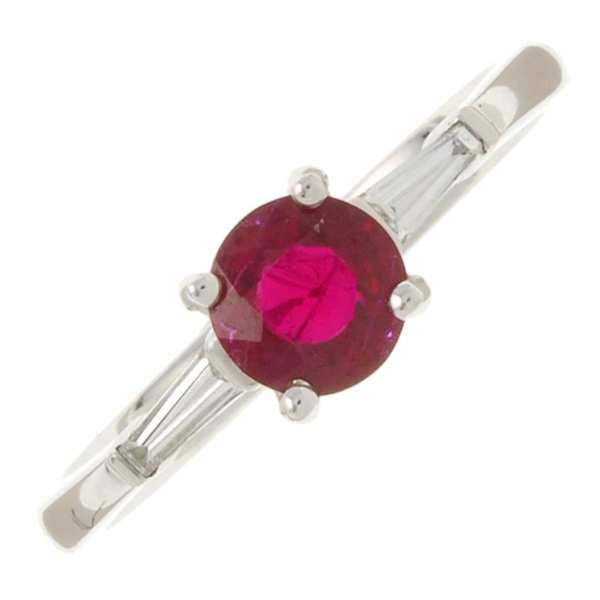 An 18ct gold ruby and triangular-shape diamond three-stone ring.Ruby weight 0.68ct.Total diamond