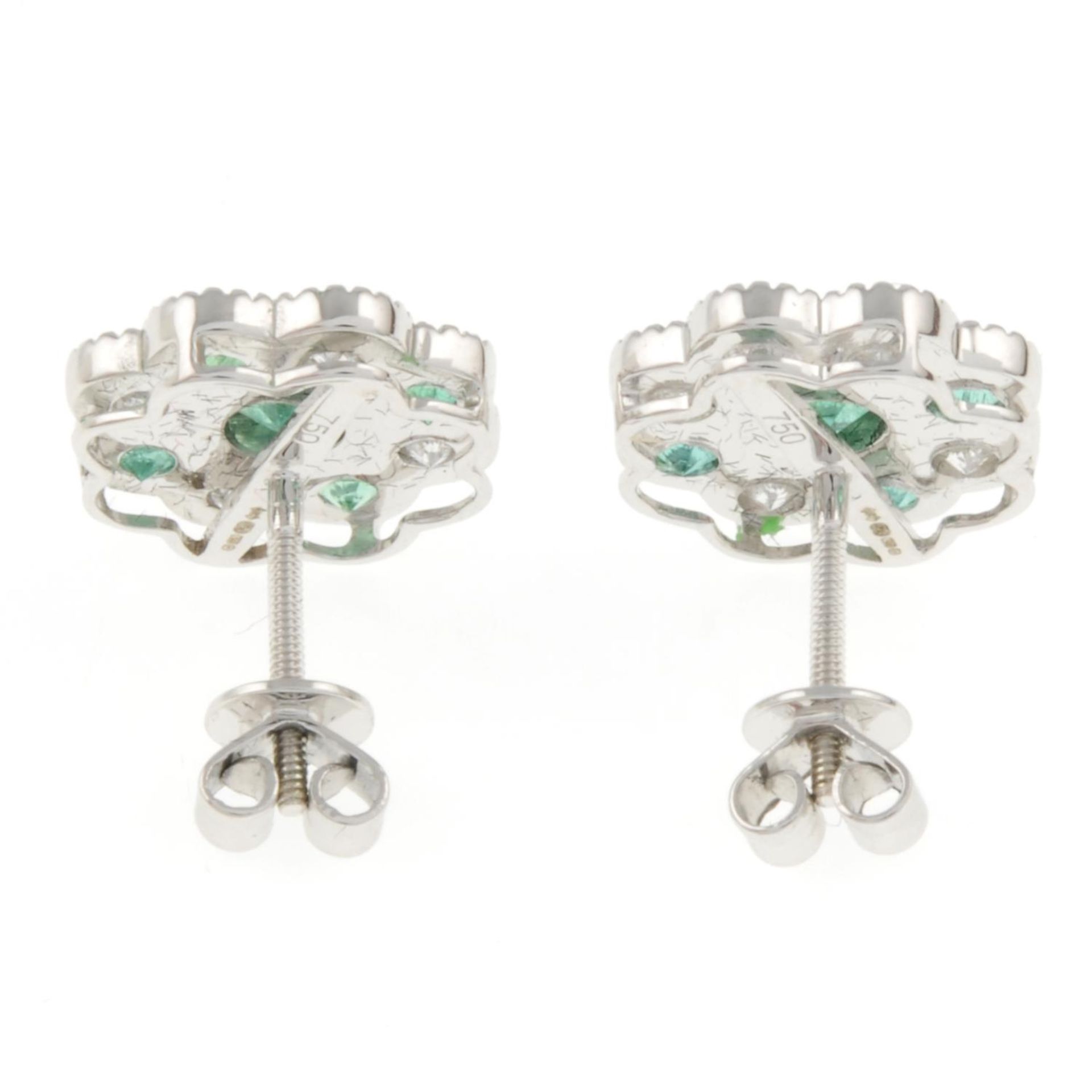 A pair of 18ct gold emerald and brilliant-cut diamond floral cluster earrings.Total emerald weight - Image 3 of 3