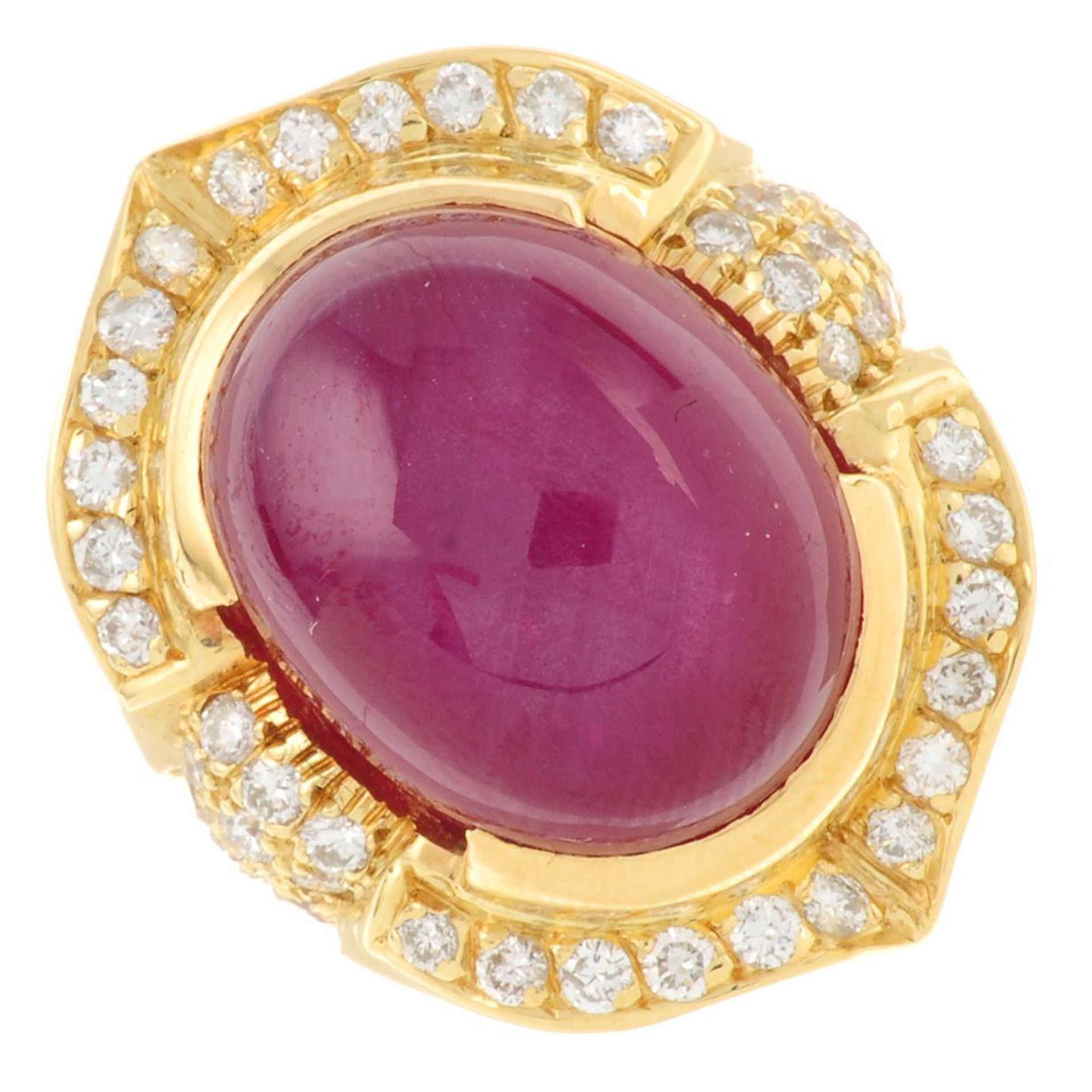 A star ruby cabochon and brilliant-cut diamond cluster ring.Estimated dimensions of ruby 18.1 by