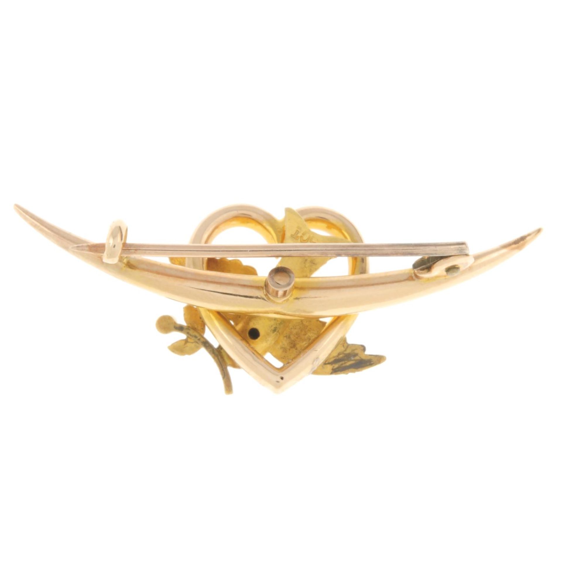 An early 20th century 15ct gold swallow brooch, with split pearl highlight. - Image 2 of 2