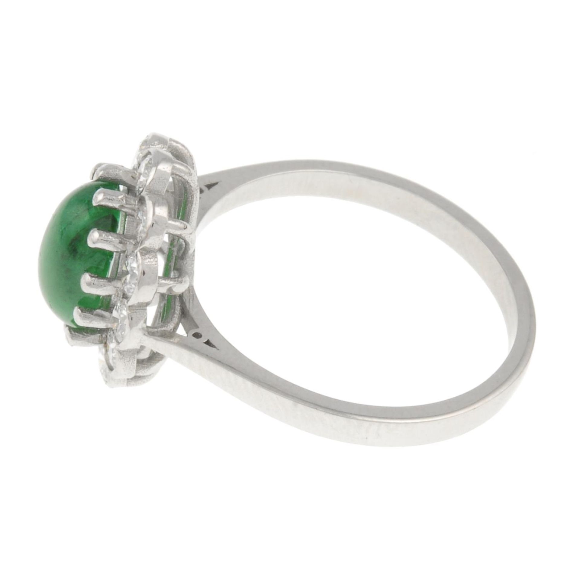 An emerald cabochon and brilliant-cut diamond cluster ring.Emerald calculated weight 1.57ct, - Image 2 of 4