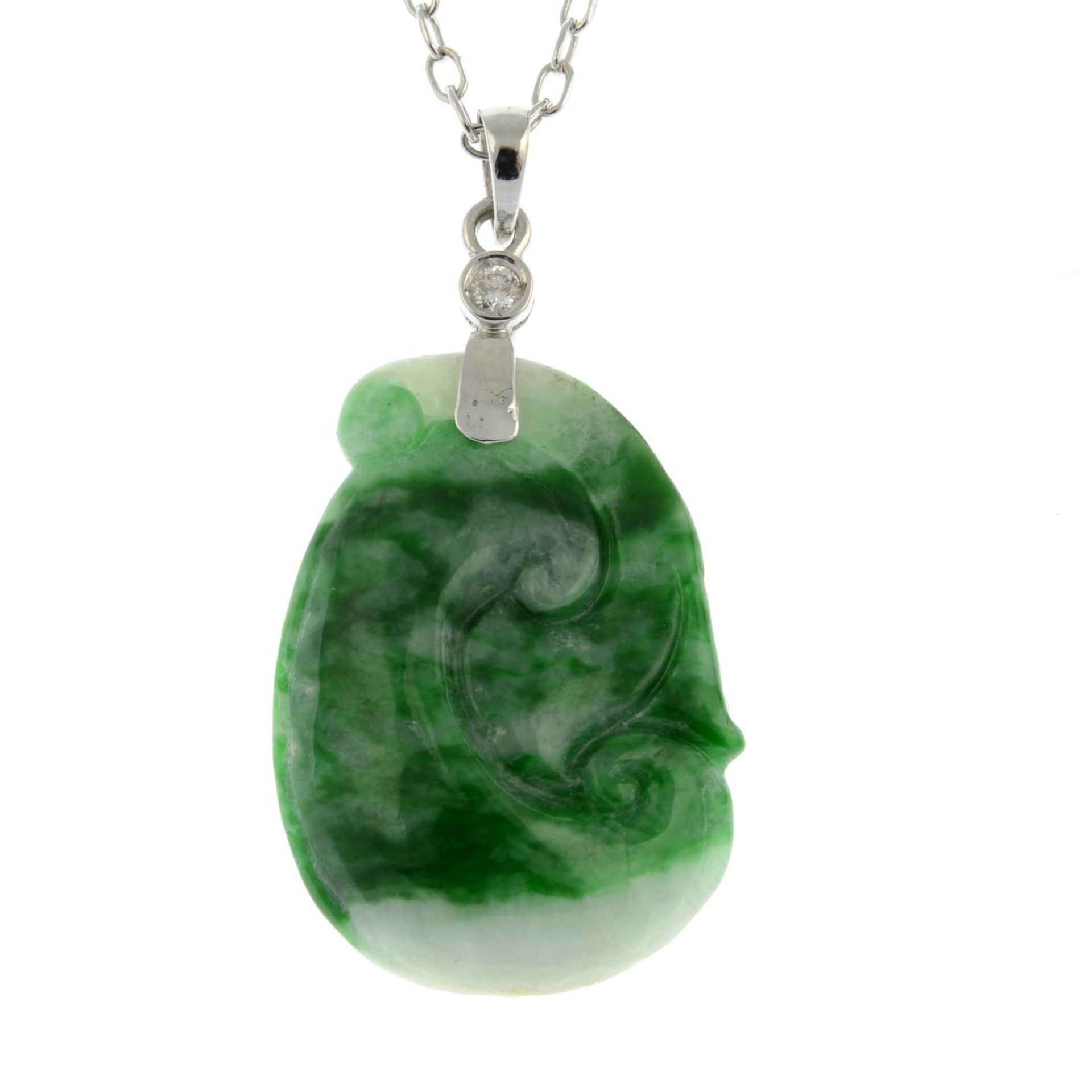 A dyed carved jade and brilliant-cut diamond pendant,