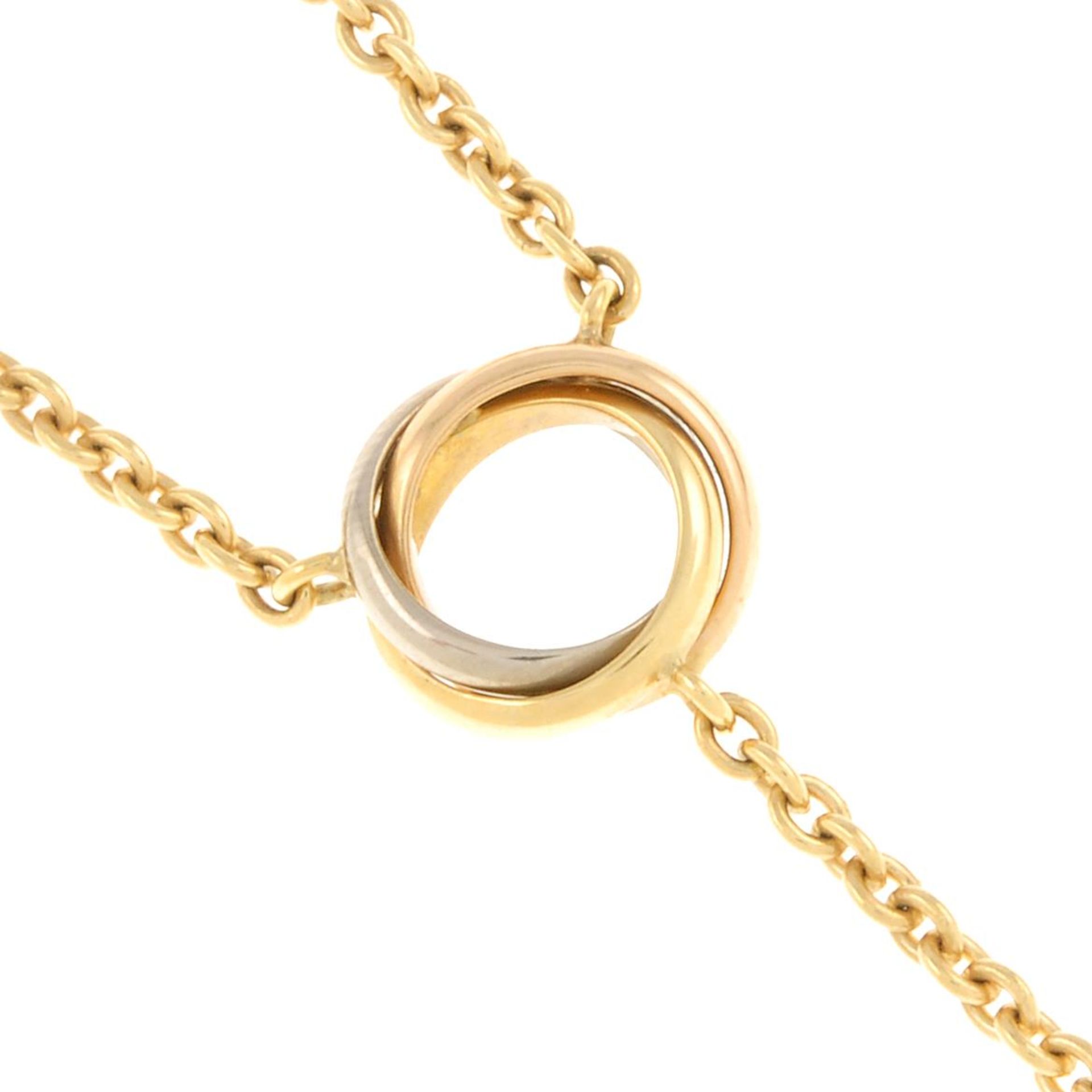 A 'Trinity' necklace, by Cartier.Signed Cartier DC4557.Stamped 750.Length 32cms.