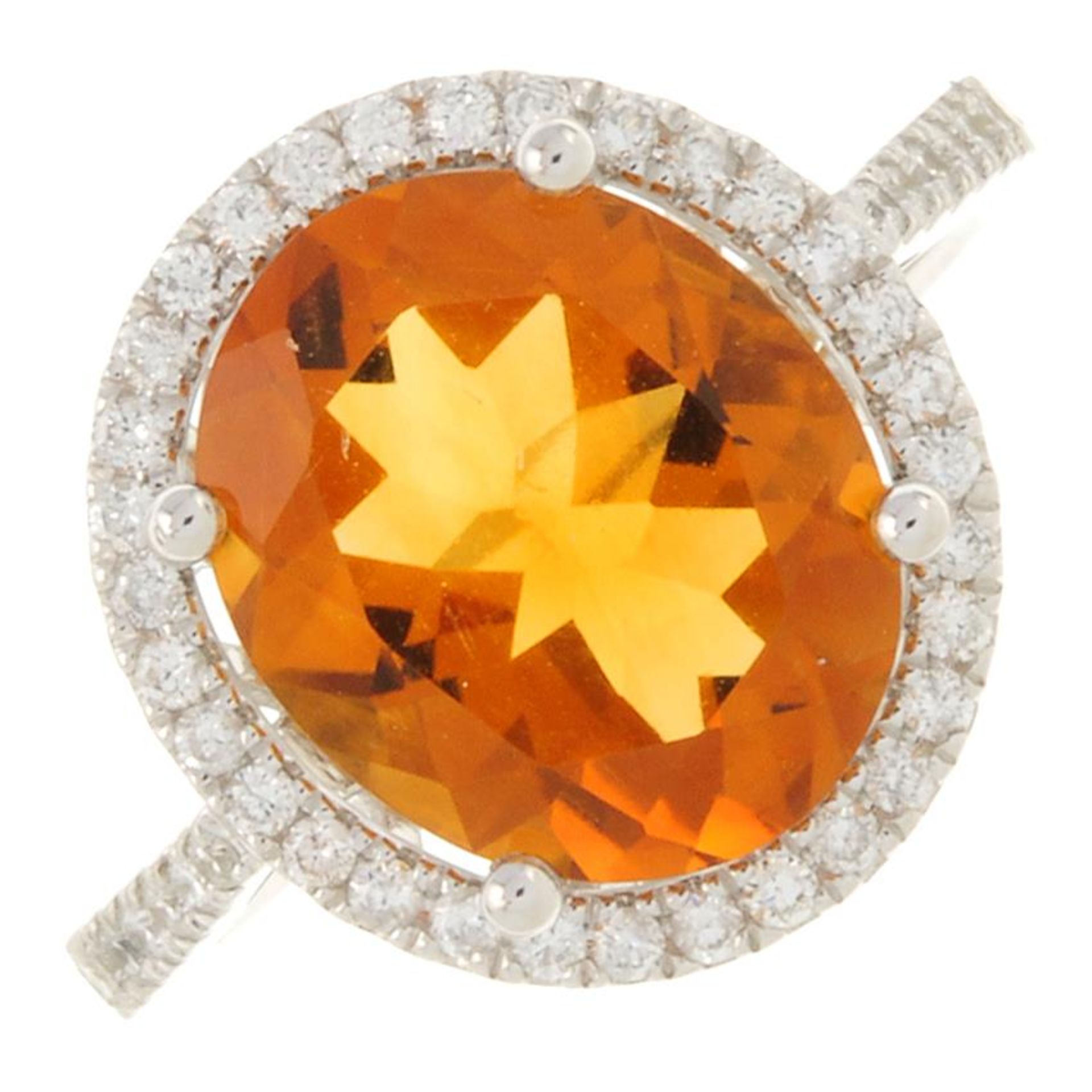 An 18ct gold citrine and brilliant-cut diamond cluster ring.Citrine weight 3.77cts.Total diamond