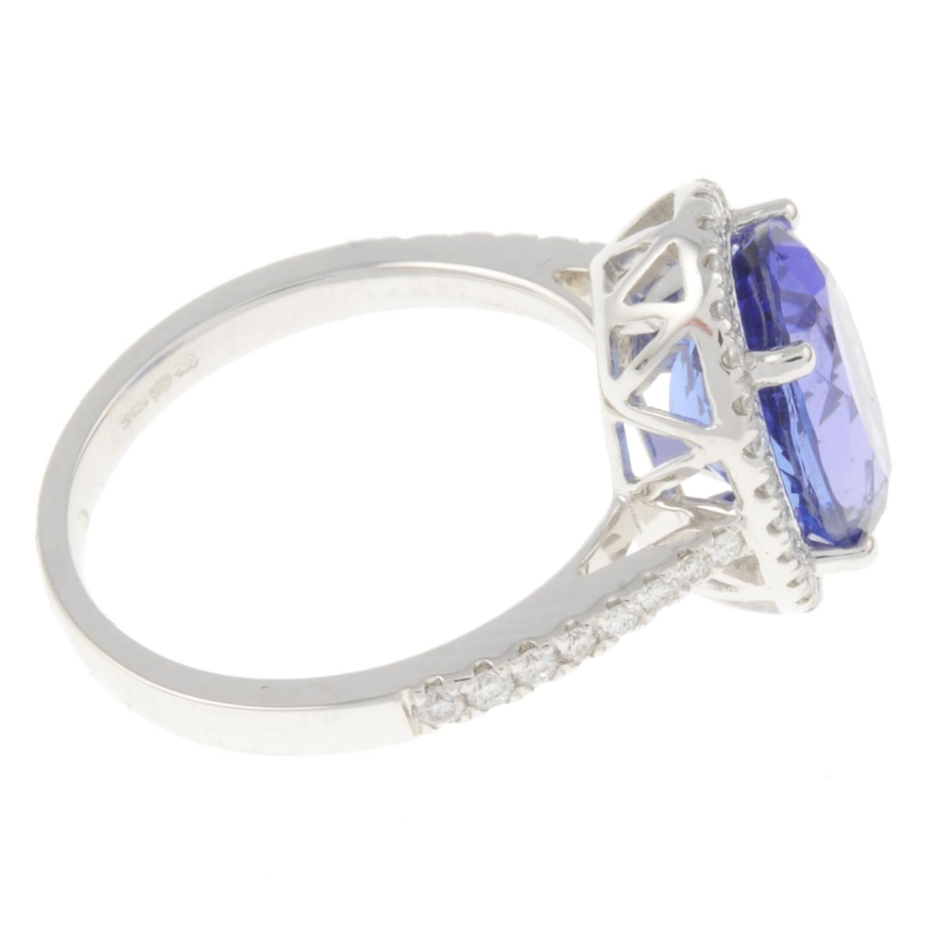 An 18ct gold tanzanite ring, with brilliant-cut diamond surround and sides. - Image 3 of 4