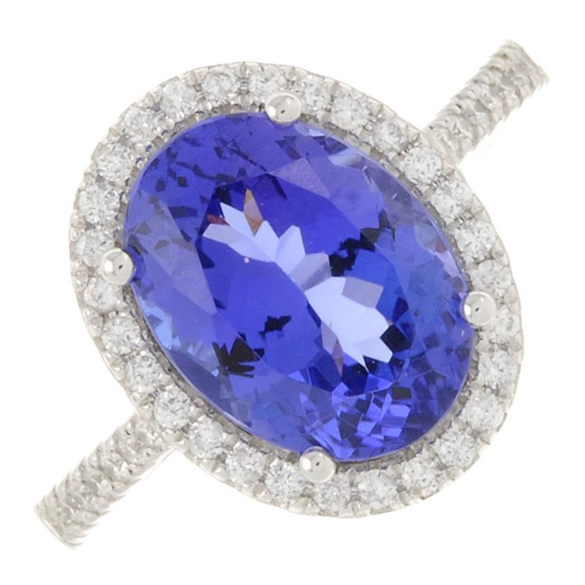 An 18ct gold tanzanite ring, with brilliant-cut diamond surround and sides.