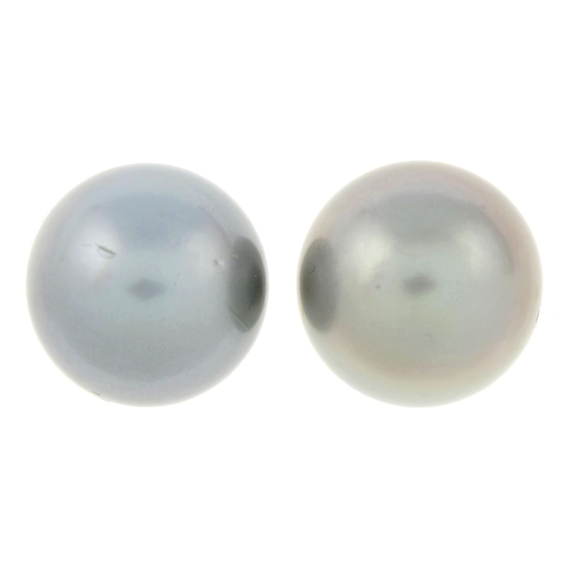 A pair of tahitian cultured pearl stud earrings.