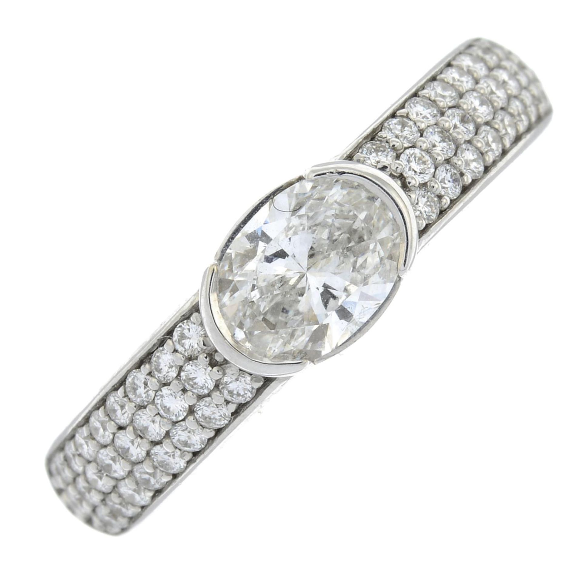An 18ct gold oval-shape diamond ring,