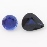 Two vari-shape blue sapphires.