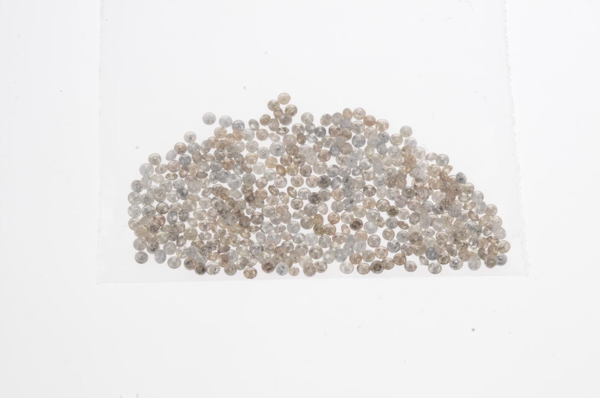 A small selection of round brilliant-cut melee diamonds and 'brown' melee diamonds. - Image 2 of 2