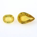 Two vari-shape yellow sapphires.