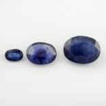Three oval-shape blue sapphires.