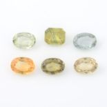 Six oval and rectangular shape vari-colour sapphires, weighing 5.71ct.