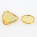 Two vari-shape yellow sapphires.