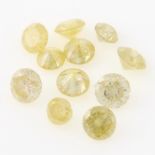 A small selection of brilliant cut light yellow diamonds.