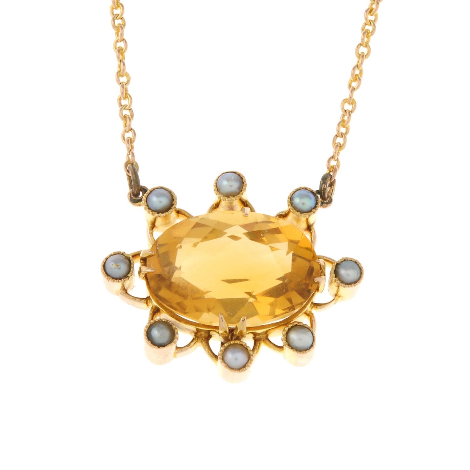An early 20th century 9ct gold citrine and split pearl pendant,