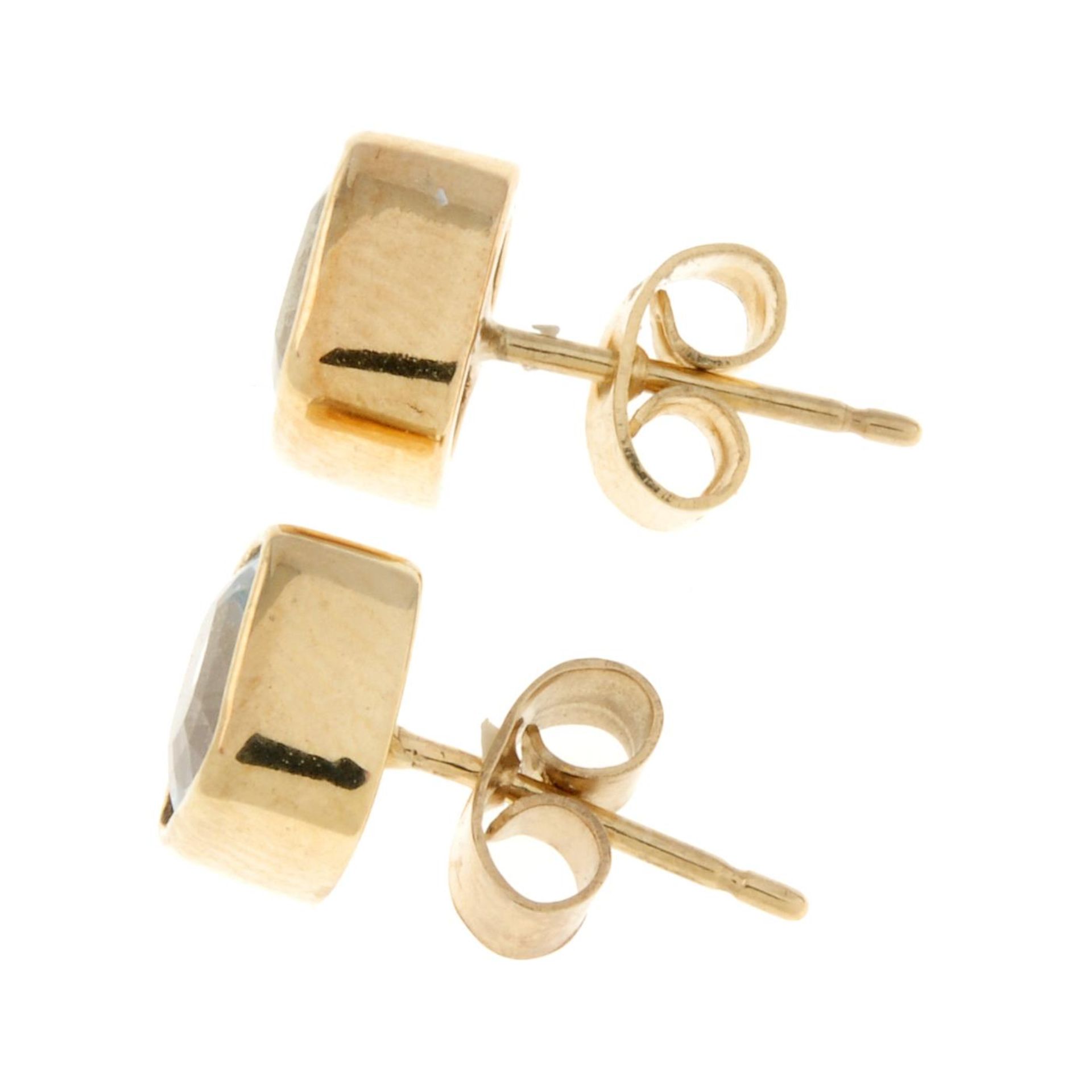 A pair of 9ct gold aquamarine stud earrings.Hallmarks for 9ct gold. - Image 2 of 2