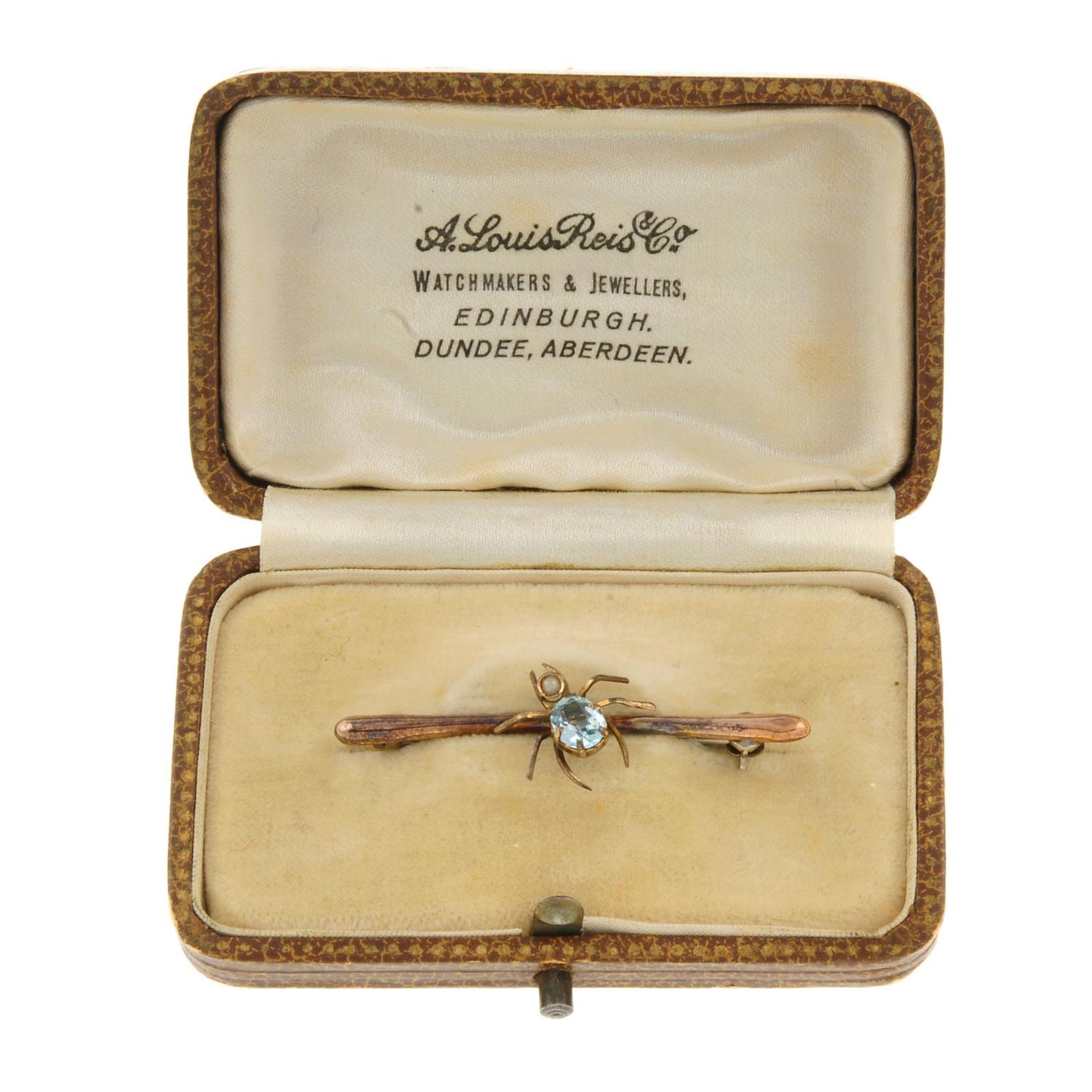 An early 20th century 9ct gold aquamarine and split pearl spider bar brooch.Stamped 9CT. - Image 3 of 3