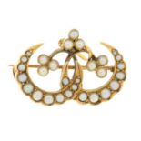A Victorian gold seed pearl crescent moon brooch.