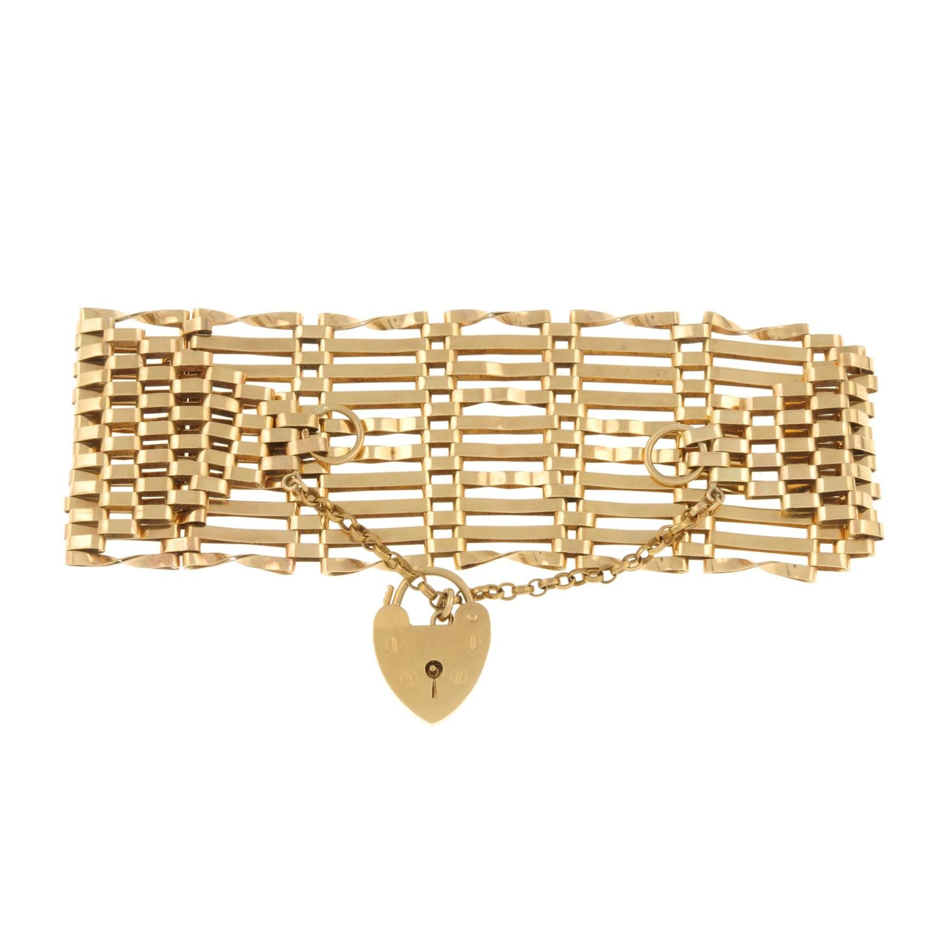 A gate bracelet, gathered at a 9ct gold padlock clasp.Clasp hallmarks for 9ct gold.