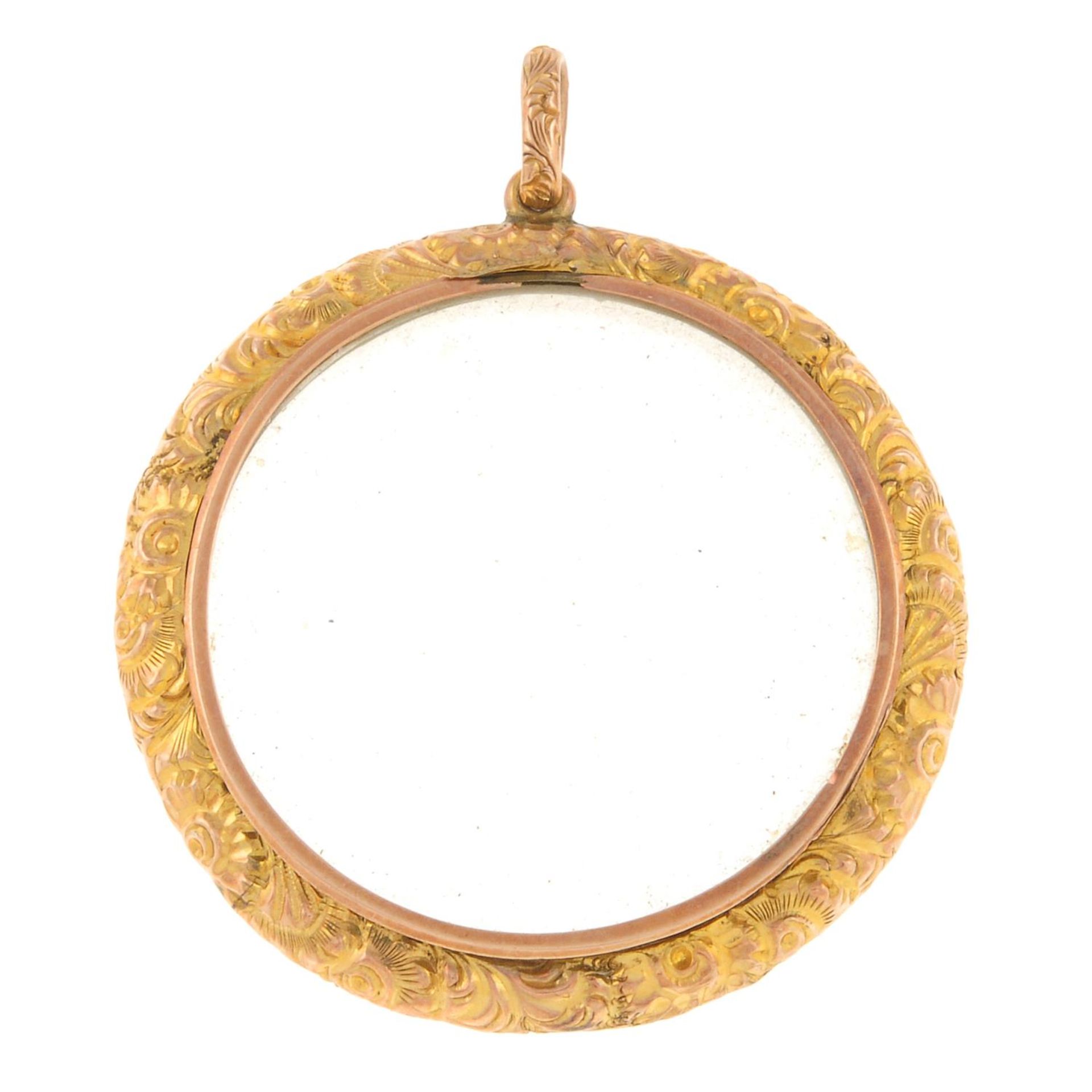 A late 19th century gold locket, with scrolling foliate surround and surmount. - Image 2 of 2