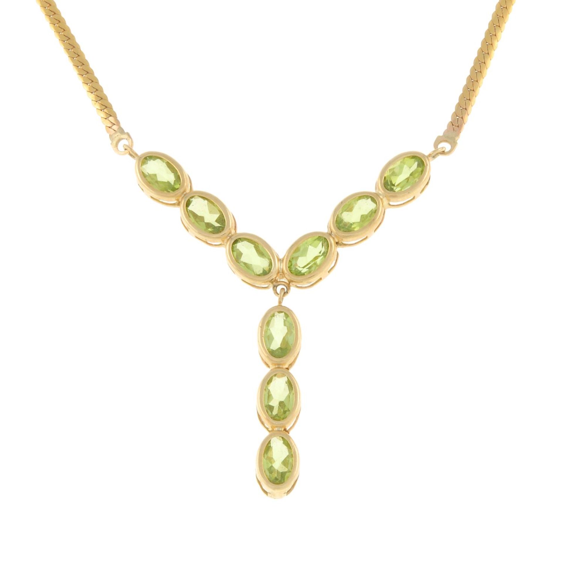 A 9ct gold peridot necklace.Hallmarks for Birmingham.Length 45cms.