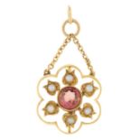 An early 20th century pink tourmaline and split pearl floral drop pendant.