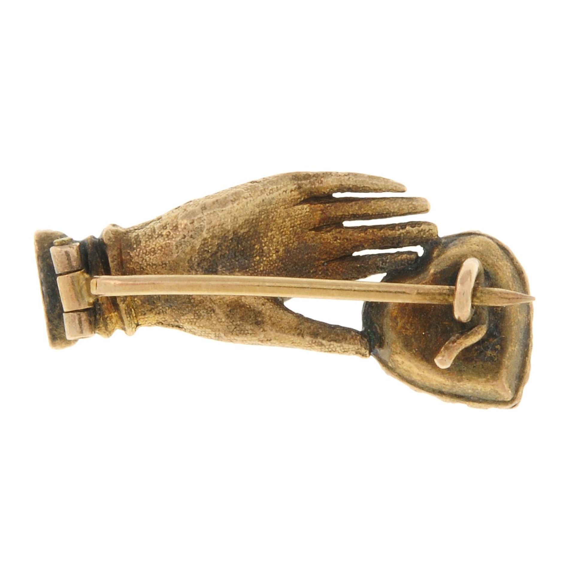 A Georgian gold mourning hand brooch.Length 2.3cms. - Image 2 of 2
