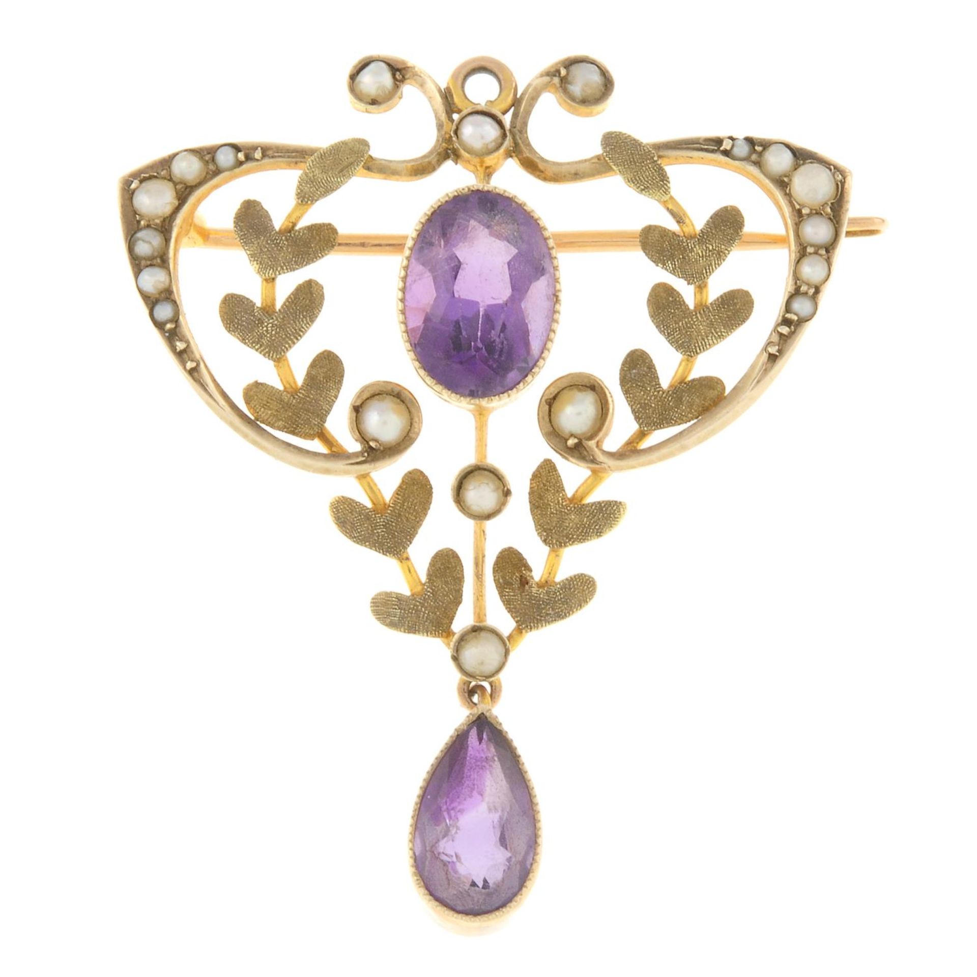 An early 20th century 9ct gold amethyst and split pearl brooch.May be worn as a pendant.