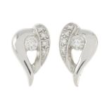 A pair of 18ct gold diamond heart earrings.Estimated total diamond weight 0.25ct.