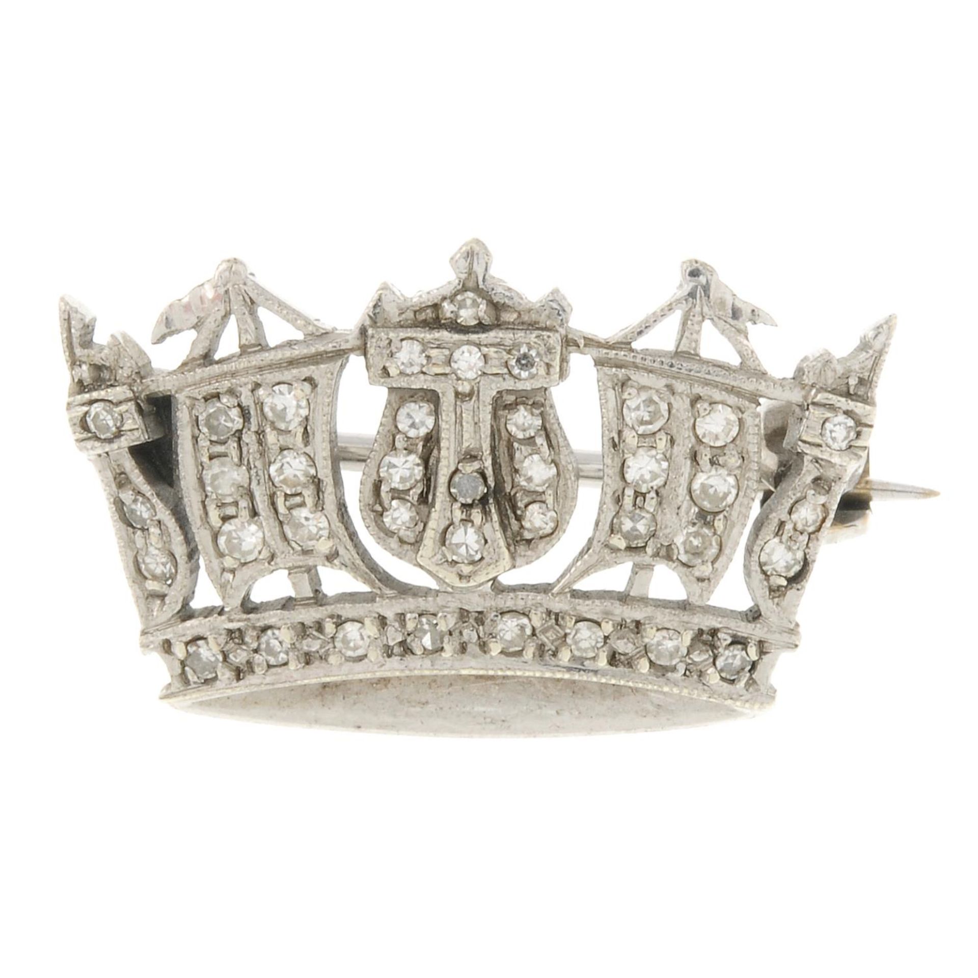 A 9ct gold diamond Naval crown brooch.Estimated total diamond weight 0.20ct.Hallmarks for